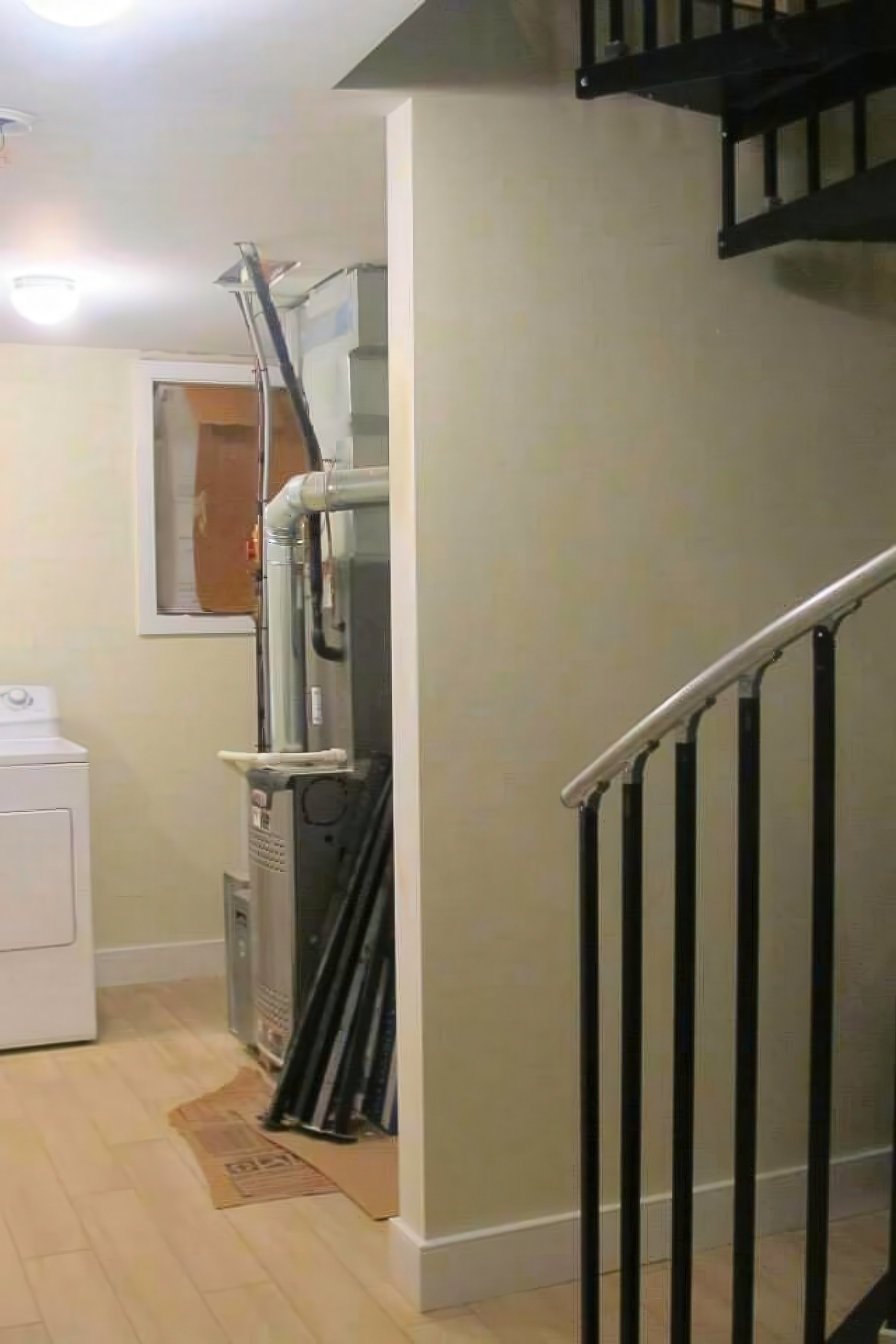 Basement level staircase and laundry area during construction