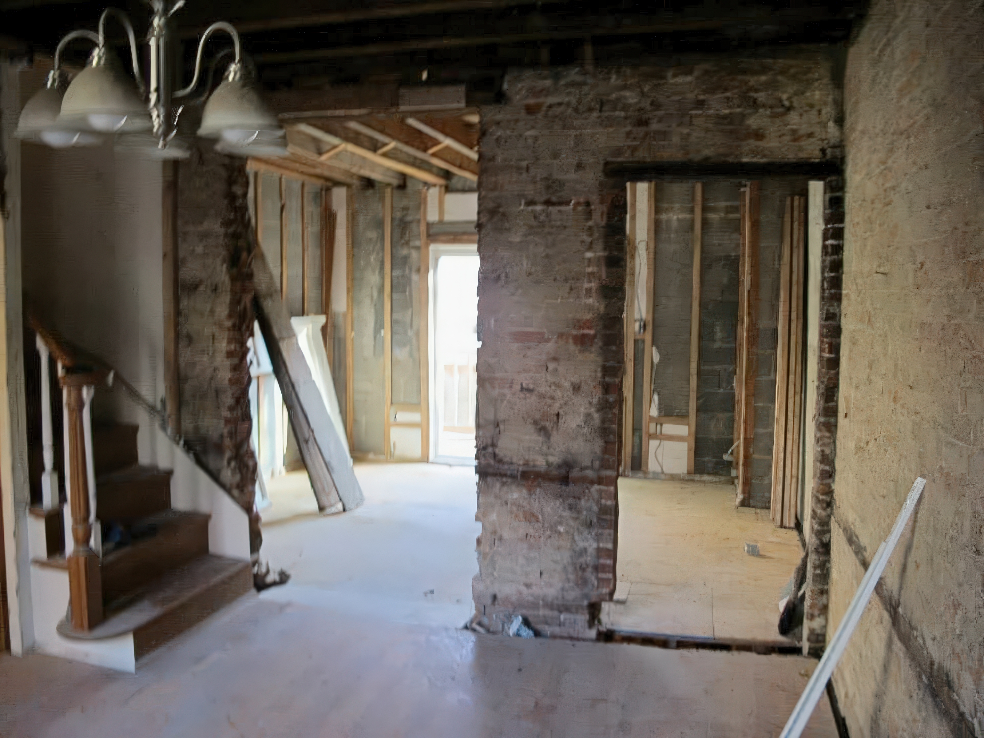 First floor demo showing staircase framing in progress