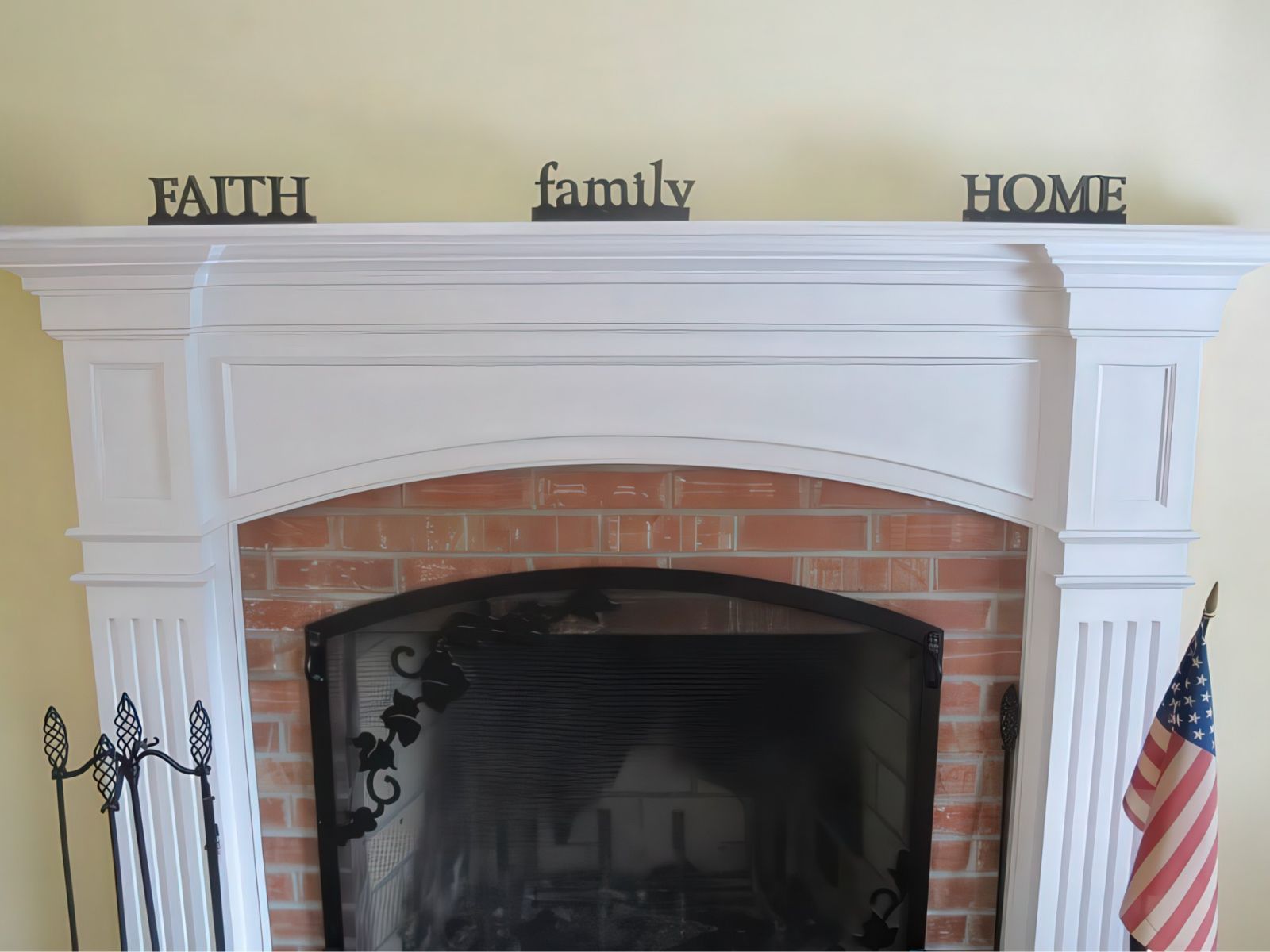 Custom fireplace mantel with crown molding and brick surround
