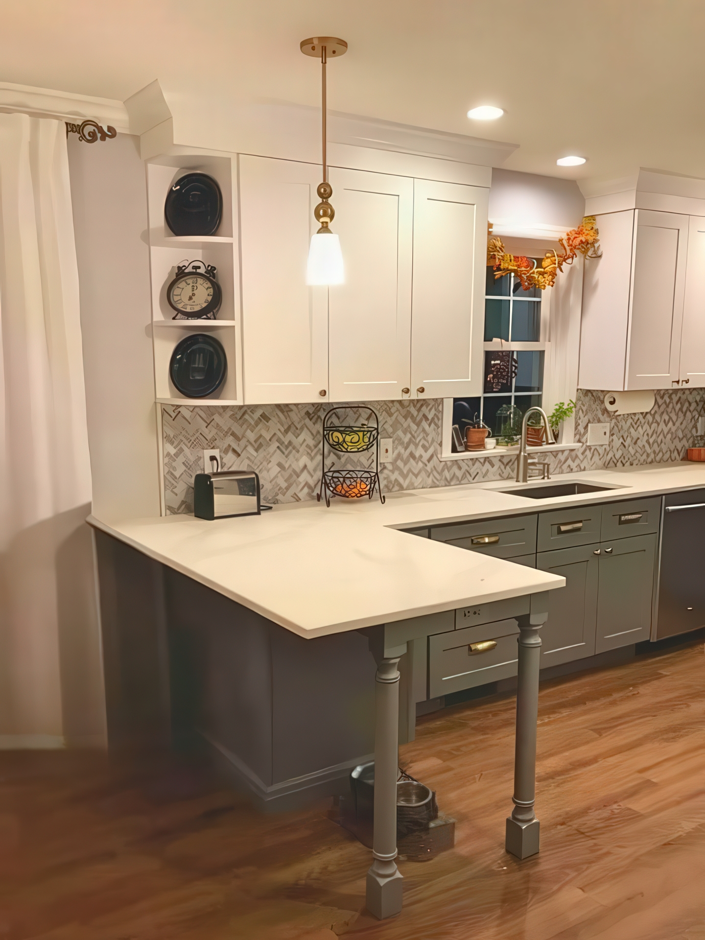 Kitchen peninsula with turned legs, open corner shelving, and herringbone backsplash