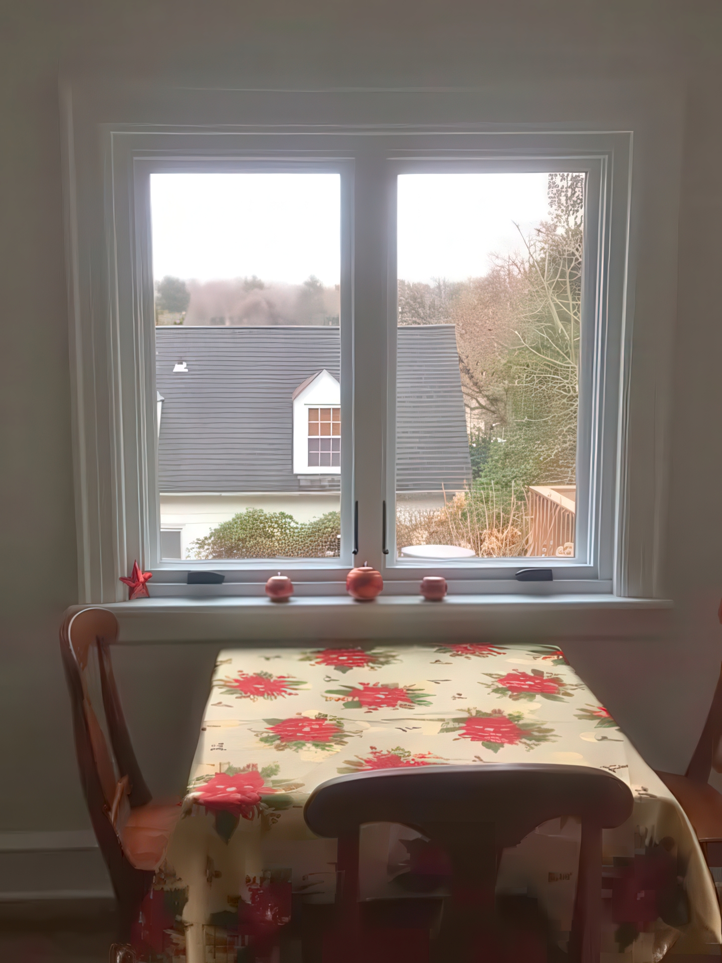Dining nook with window looking out to the neighborhood